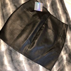 black faux leather mini skirt